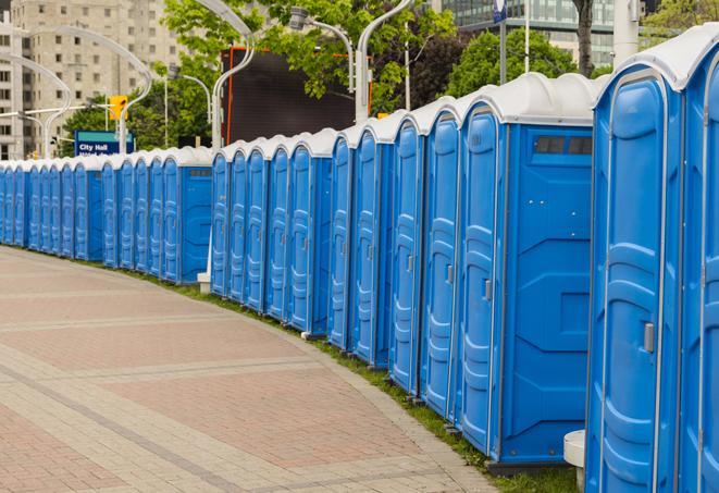 a row of portable restrooms set up for a special event, providing guests with a comfortable and sanitary option in Greenacres, FL